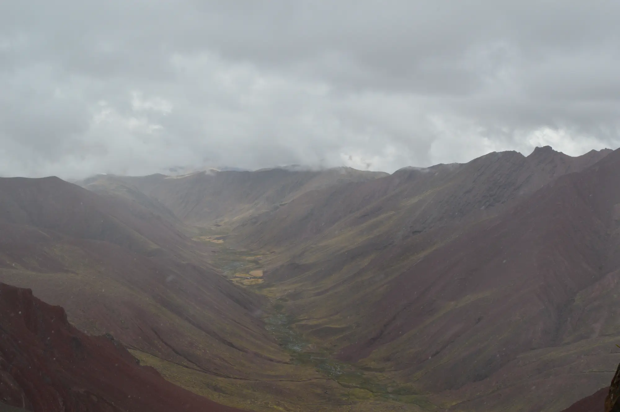 Cloudy mountain valley near Rainbow Mountain
