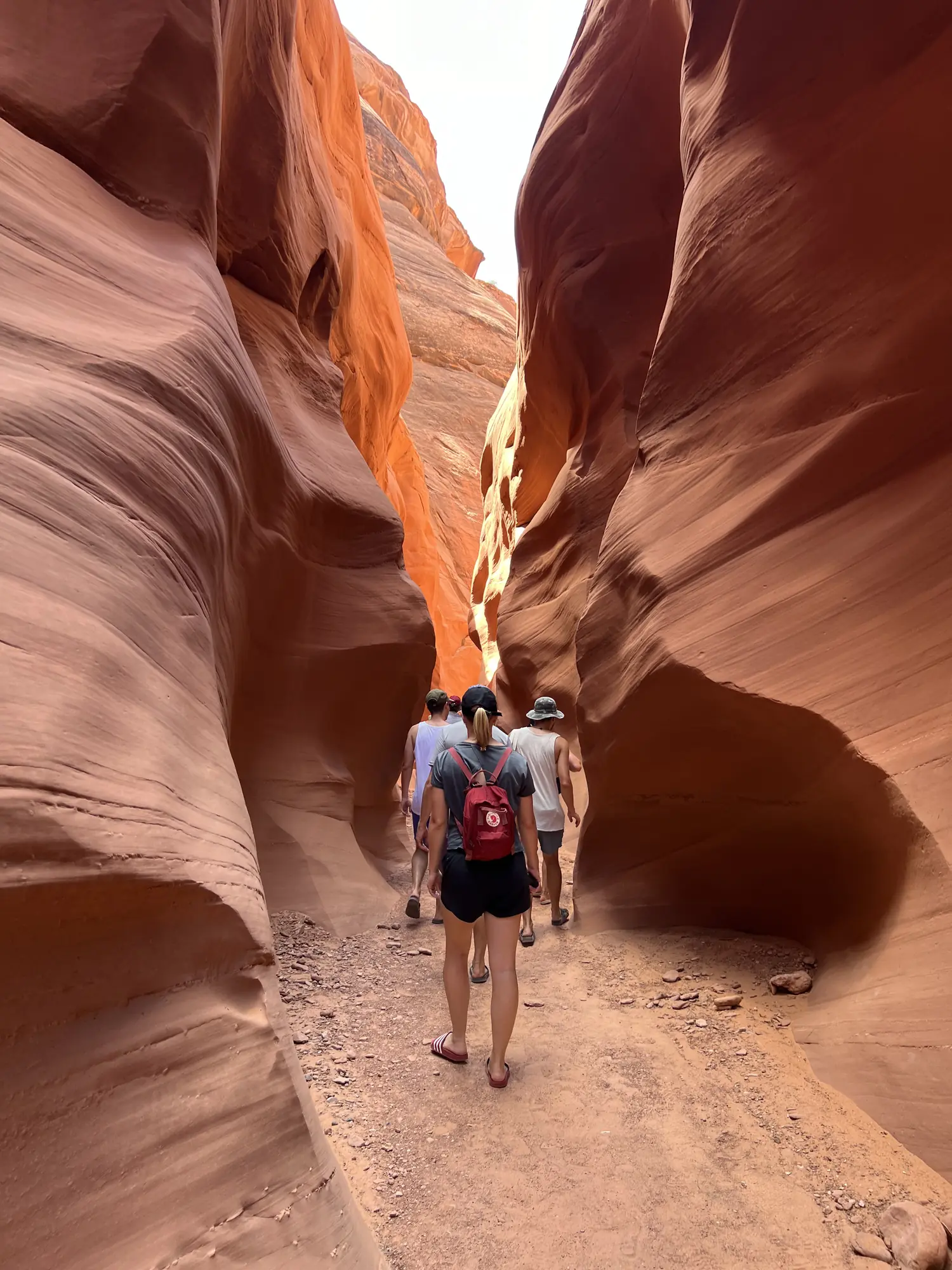 Walking through the narrow orange sandstone walls of Antelope Canyon