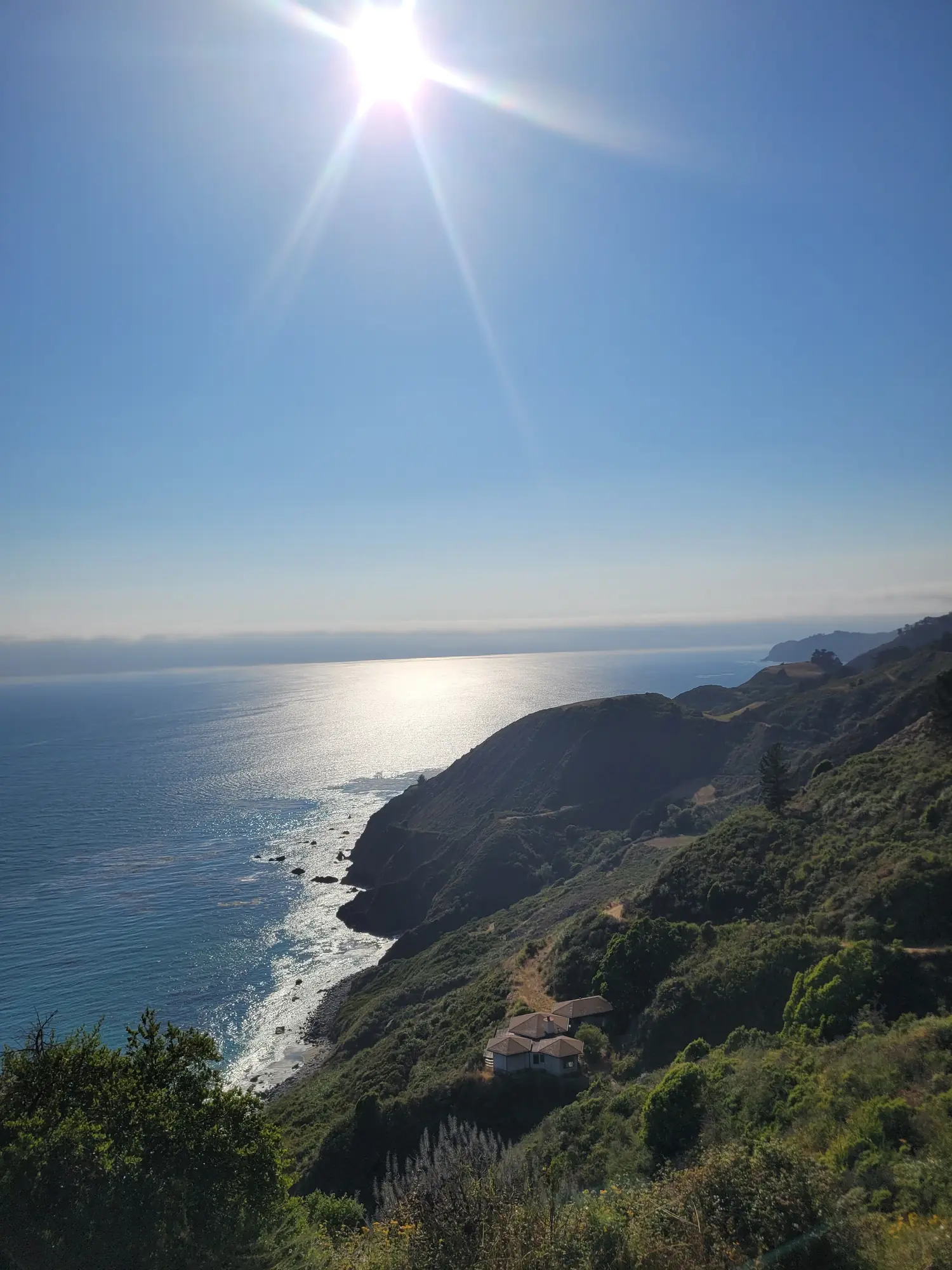 Highway 1 coastline with sun over the ocean
