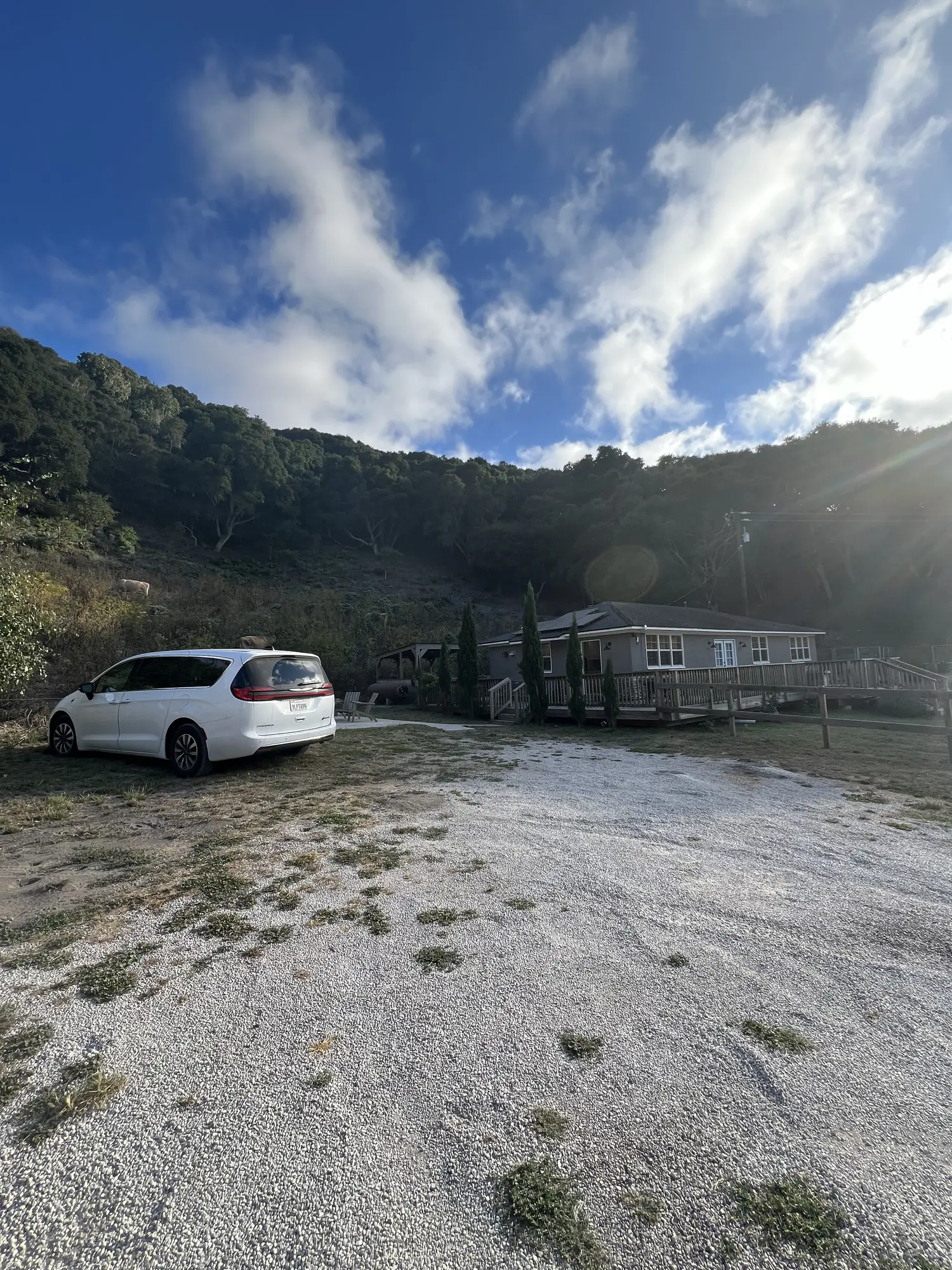 Car parked near a coastal roadside stop on Highway 1