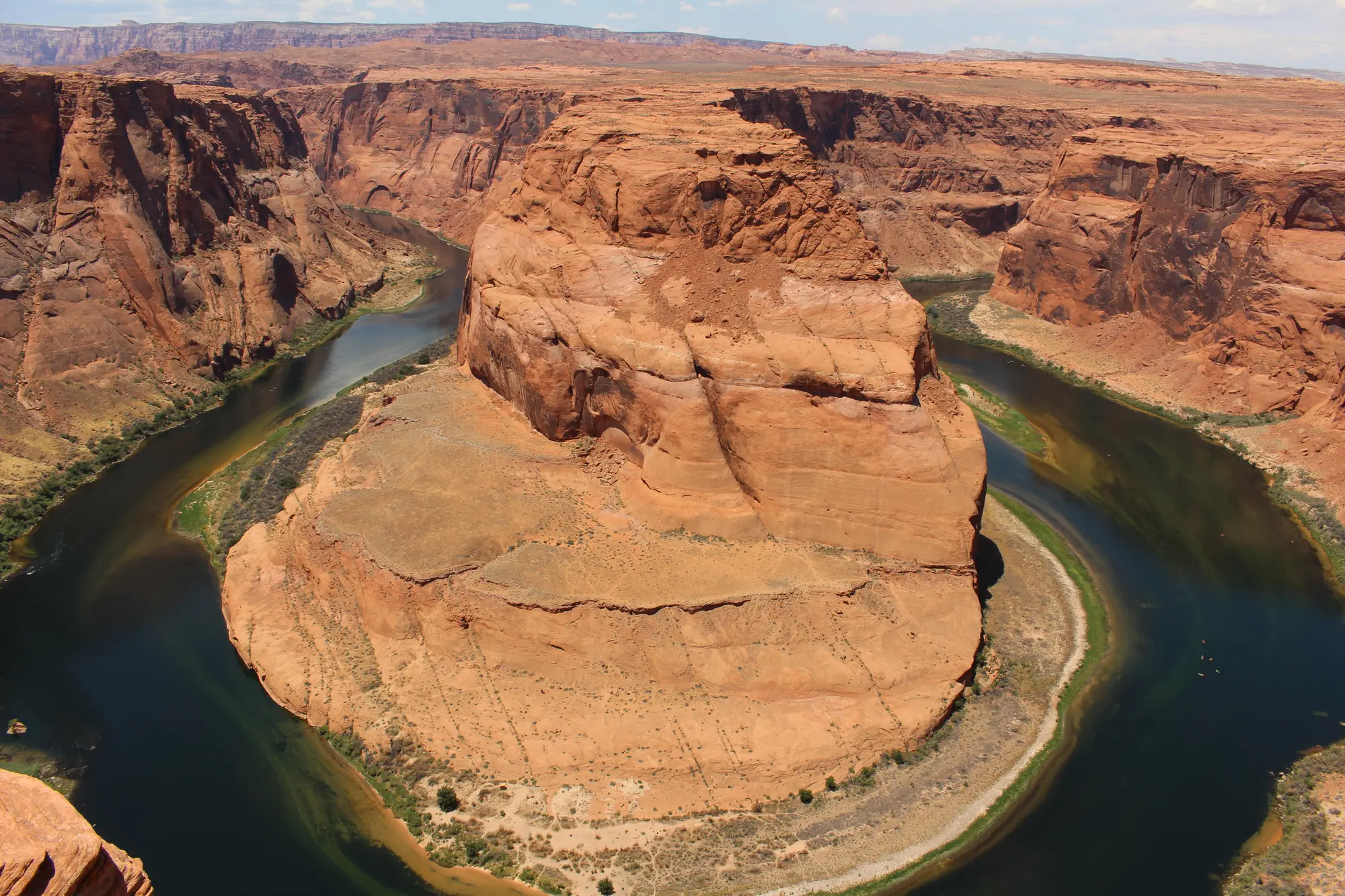 Horseshoe Bend with the Colorado River curving around the sandstone
