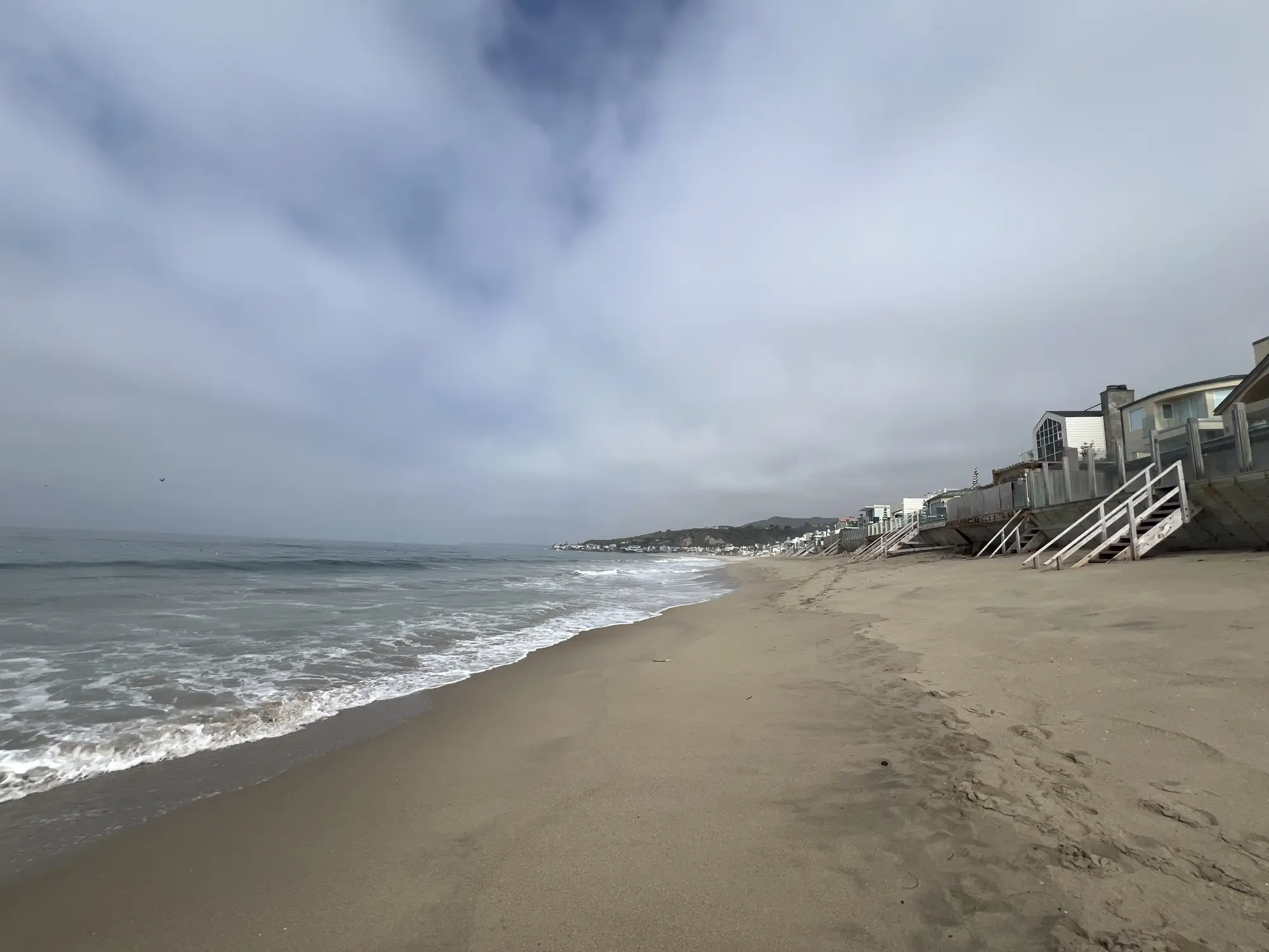 Gray beach and ocean waves near Malibu